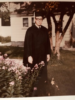 Picture of Garth in graduation robe